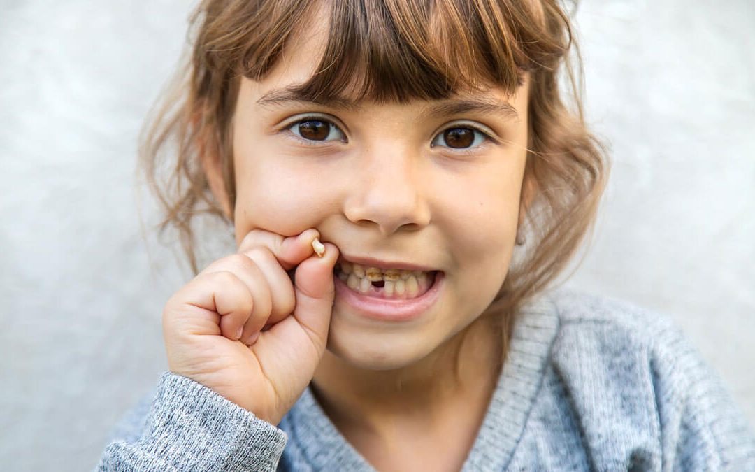Child with loose tooth