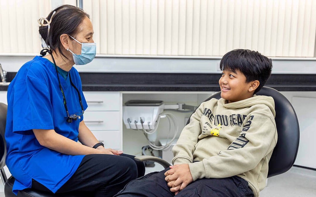 Dentists discussing braces with a child at GRDC